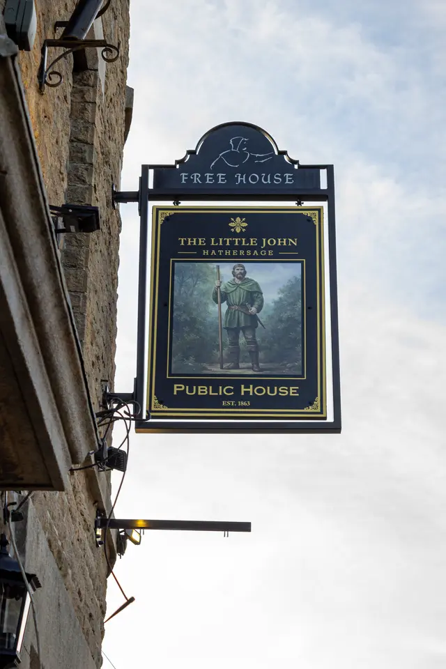 The Free House sign showing Little John with his quarterstaff